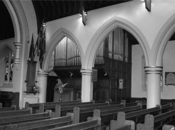Photo showing the old church organ (with pipes)