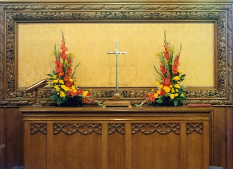 Photo showing the communion table and silver cross