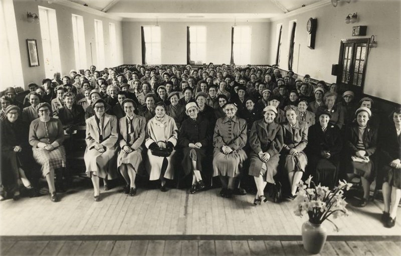 Photo of a meeting of Women's Own in the upper hall of the Parish Halls