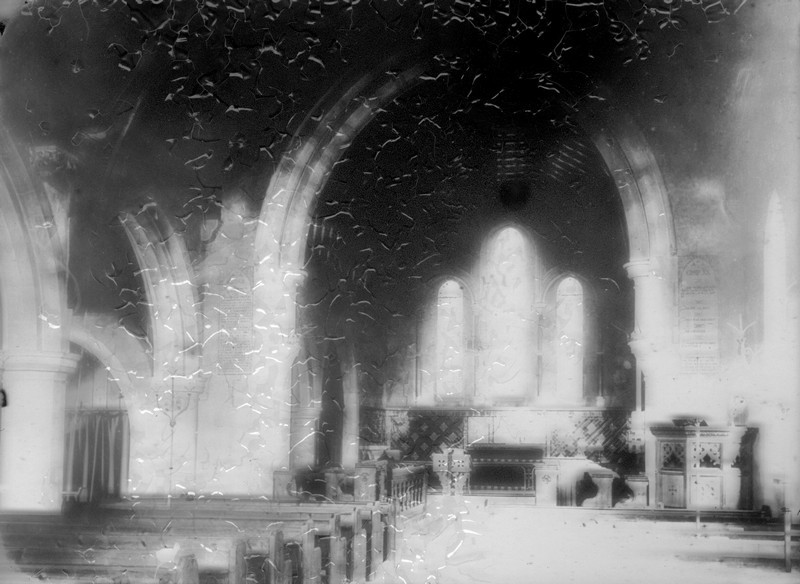 Photograph showing the interior of Christ Church during the Stirling era, looking towards the windows in the east wall. Pews are visible on the left and a pulpit on the right.