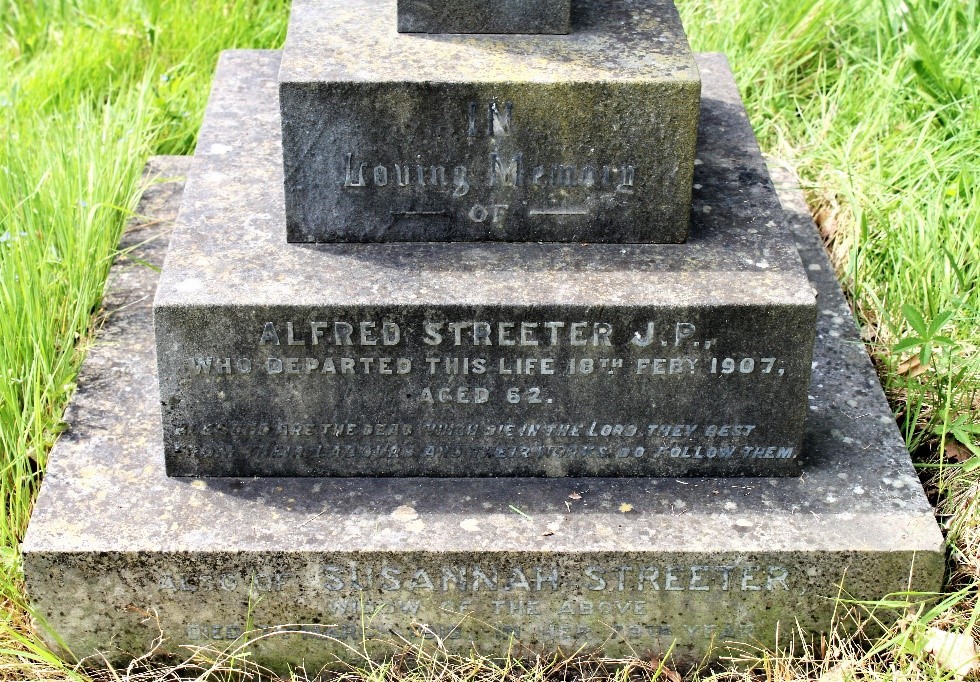 Close up of Alfred Streeter's gravestone 'In loving memory of Alfred Streeter JP who departed this life 18th February 1907 aged 62'