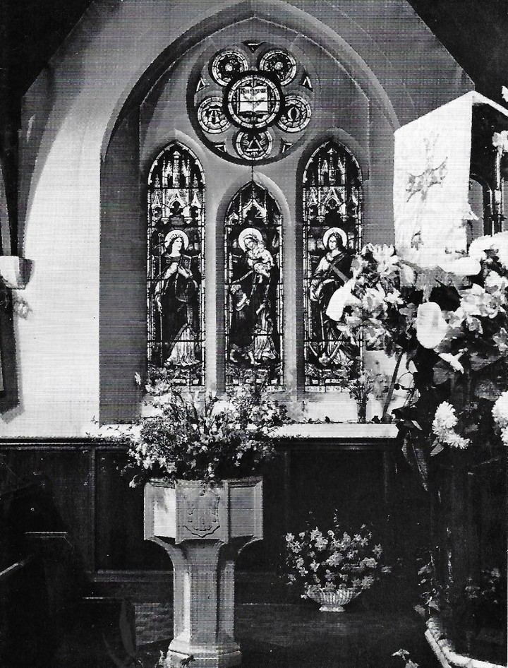 Monochrome photograph of the 'Faith, Hope and Love' window in memory of Alfred Streeter, in its original east wall location